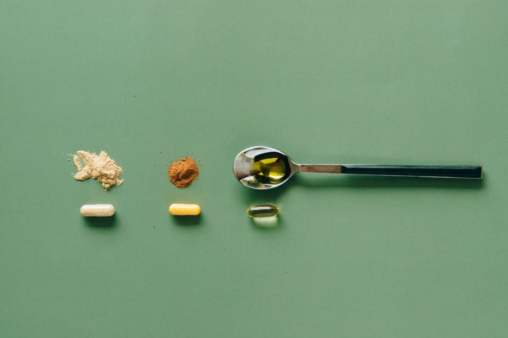 A picture of supplements line up with a green background.
