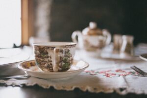 A tea cup sitting near a window