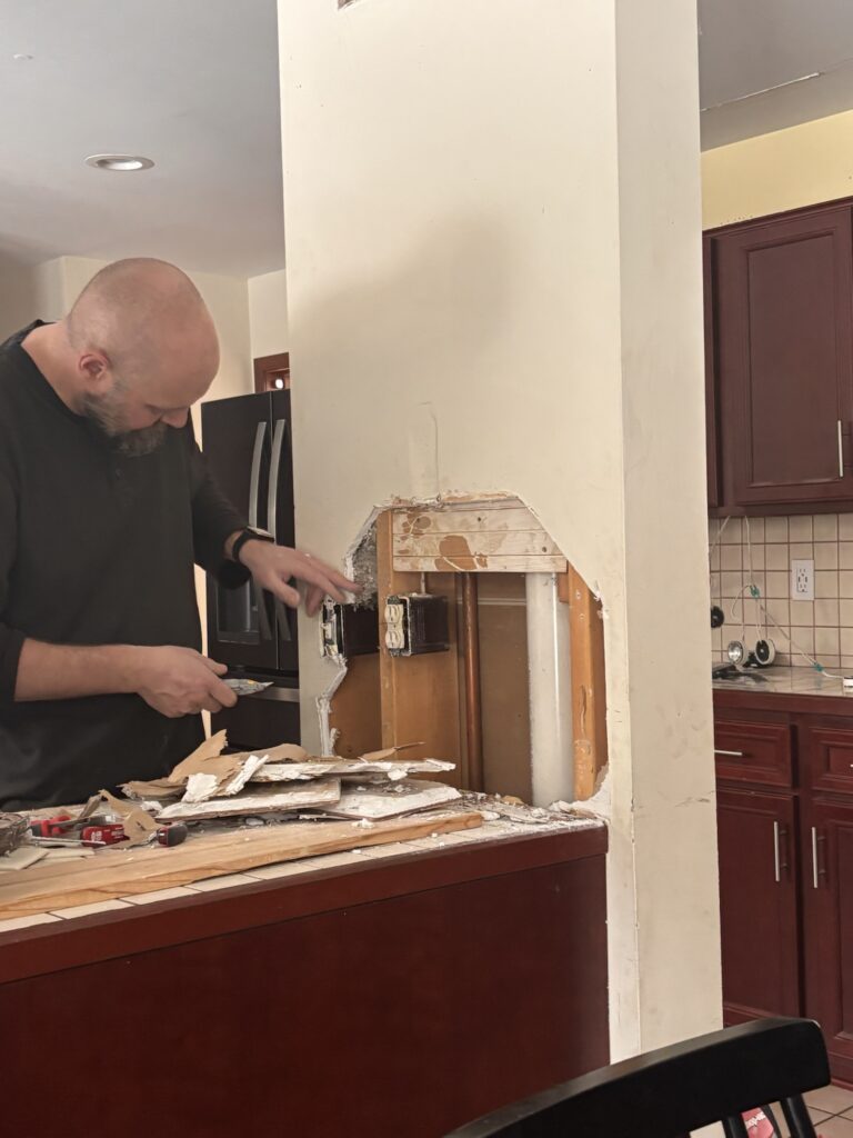 This wall or pillar goes all the way from the ceiling to the floor. And of course, it has major plumbing inside of it. Hope to get it moved, but we will see.